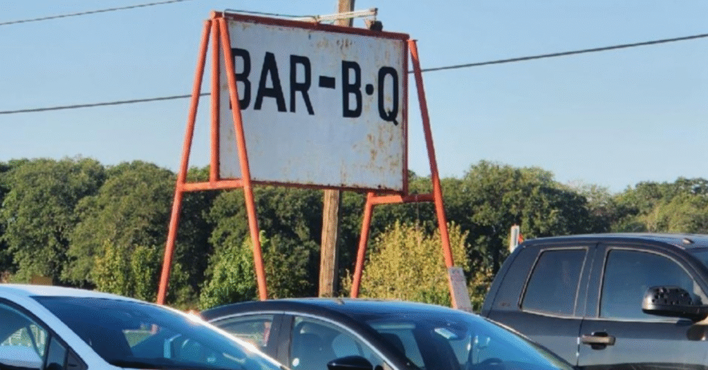 Vintage roadside BAR-B-Q sign at a Texas barbecue joint during a Texas BBQ road trip.