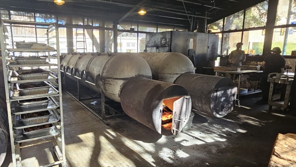 Offset smokers and firebox inside the pit room at Pinkerton’s Barbecue in San Antonio Texas